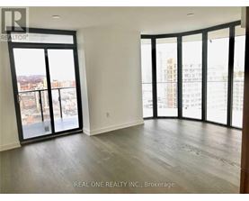 A spacious room with large windows and sliding glass doors.