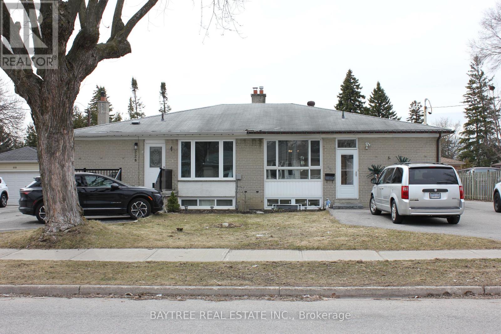 A house with a car parked in front of it.