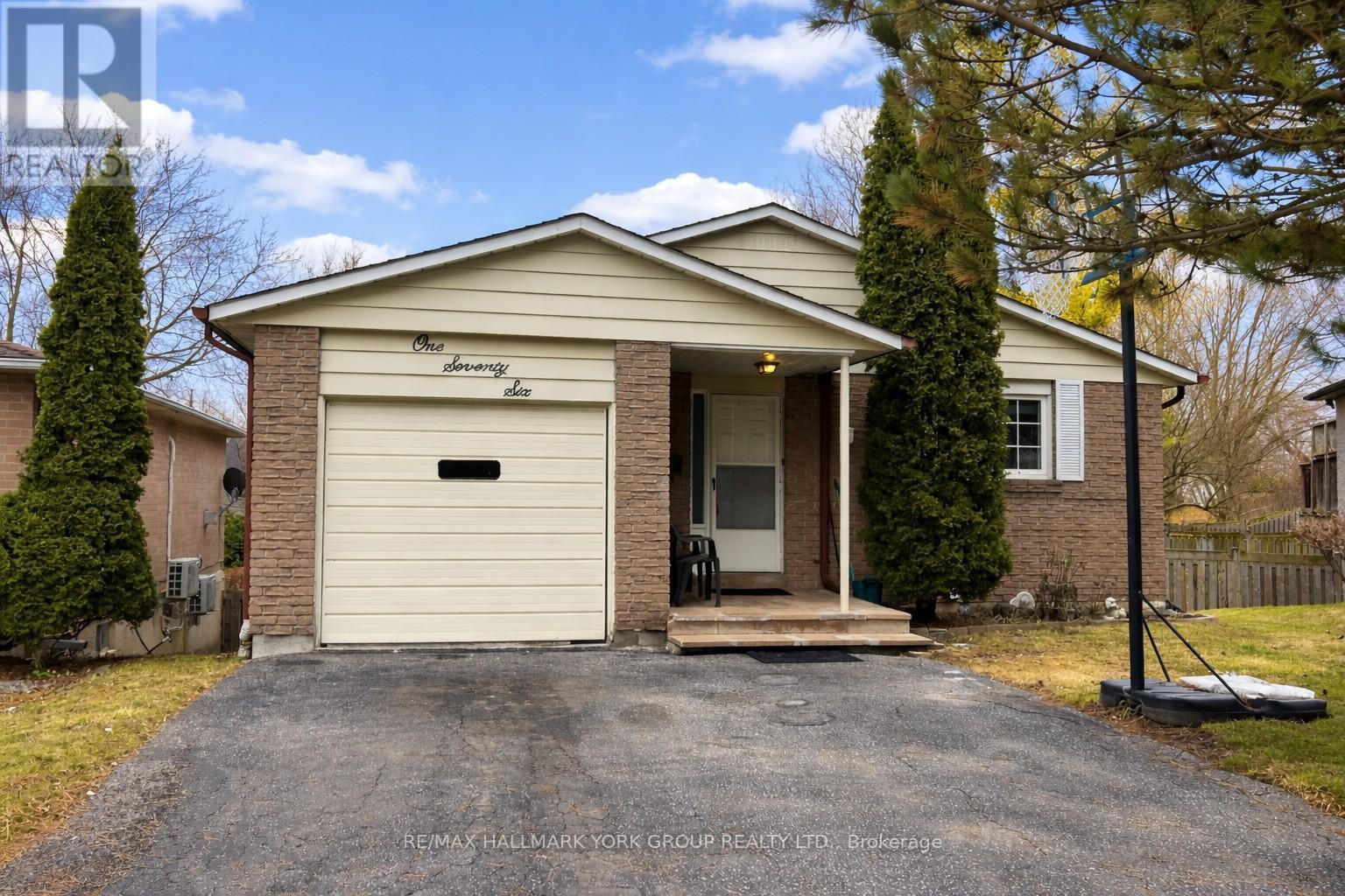 A two-story house with a garage is for sale.