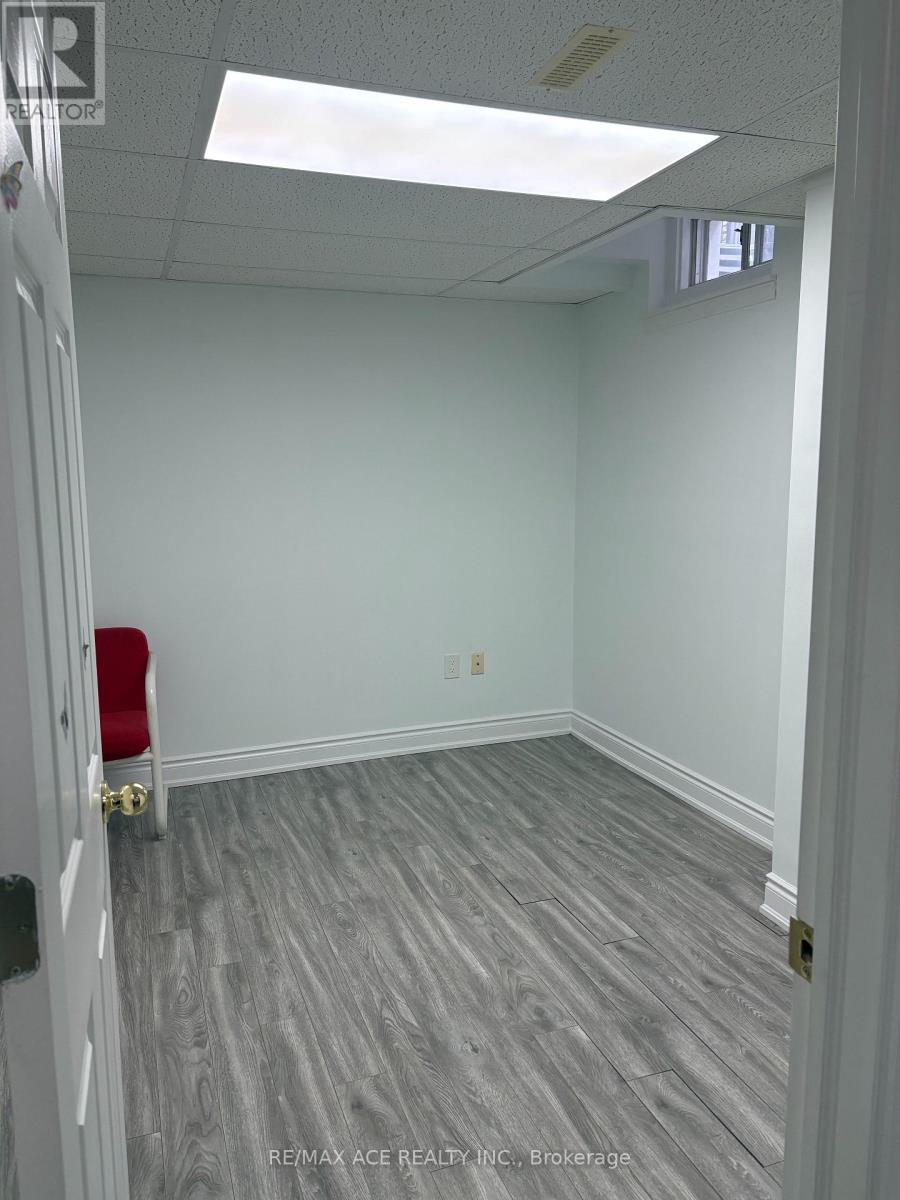 A room with a grey floor and white walls.