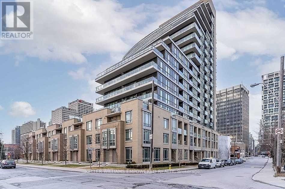 A modern building with a curved glass facade is the focal point of the image.