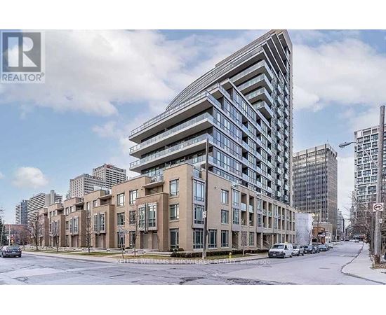 A modern building with a curved glass facade is the focal point of the image.