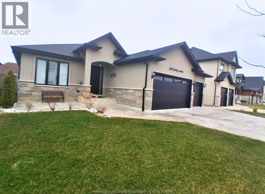 A house with a large front yard and a garage door.