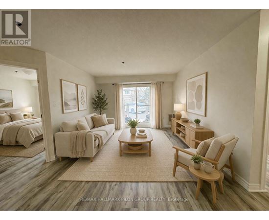 A well-lit, spacious bedroom with a large bed and a comfortable seating area.