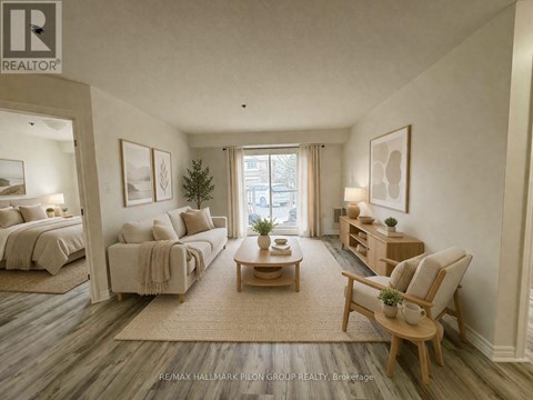 A well-lit, spacious bedroom with a large bed and a comfortable seating area.