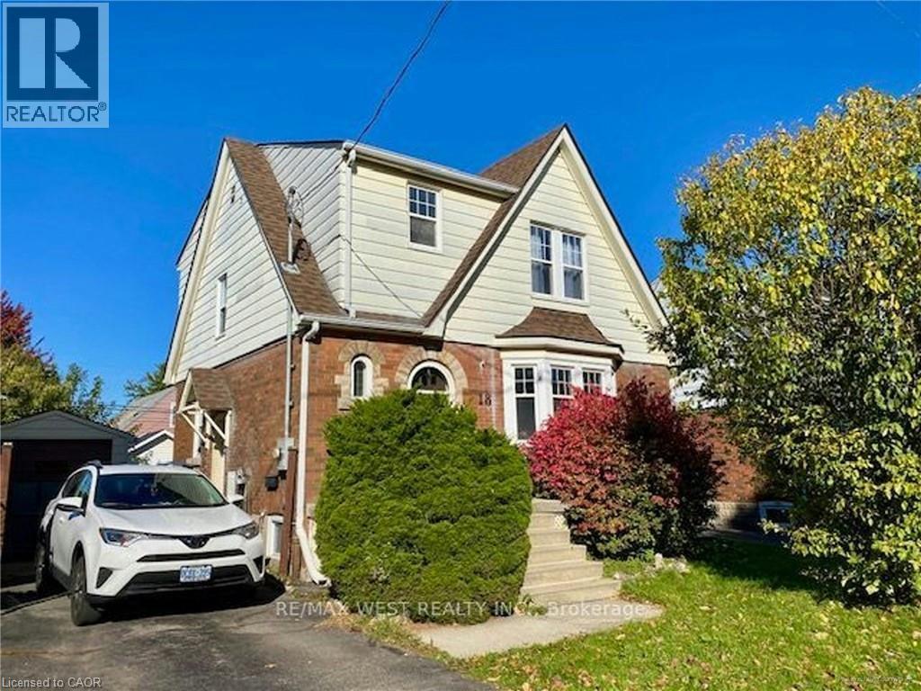 A house with a white car parked in front.