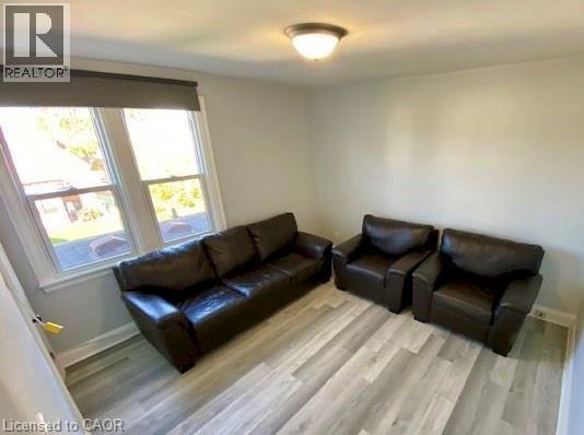 A living room with a couch and a chair.