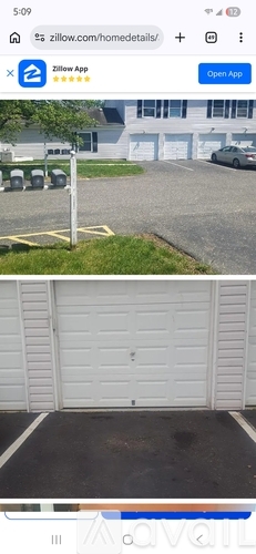 A white garage door is closed.