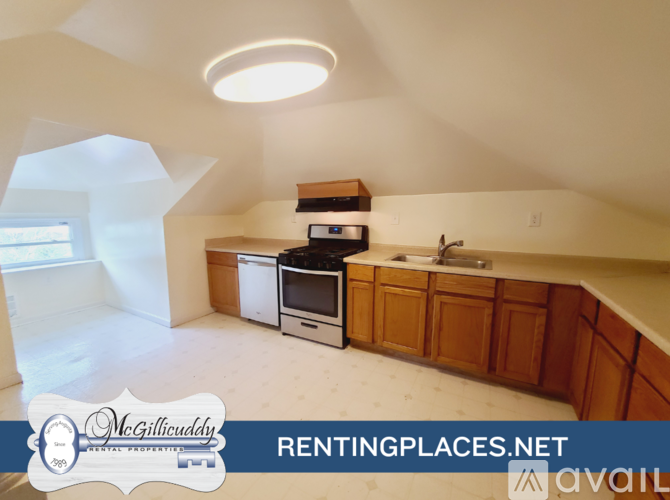 A kitchen with a stove, oven, and cabinets is available for rent.