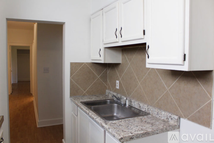 A kitchen with a sink and cabinets.