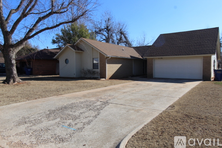A house with a driveway in front of it.