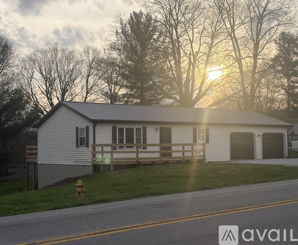 A house with a garage is available for sale.
