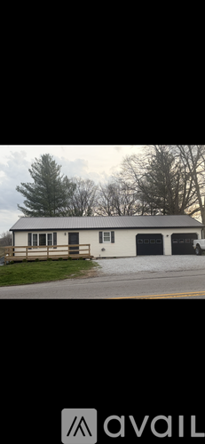 A two-story house with a garage is available for rent.
