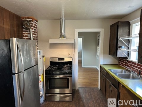 A kitchen with a stainless steel refrigerator and oven.