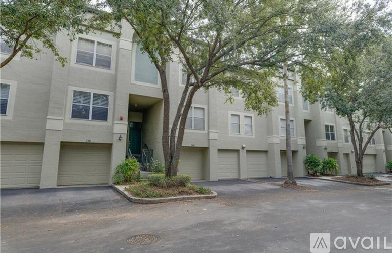 A building with a tree in front of it.