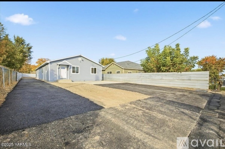 A residential area with a house and a driveway.