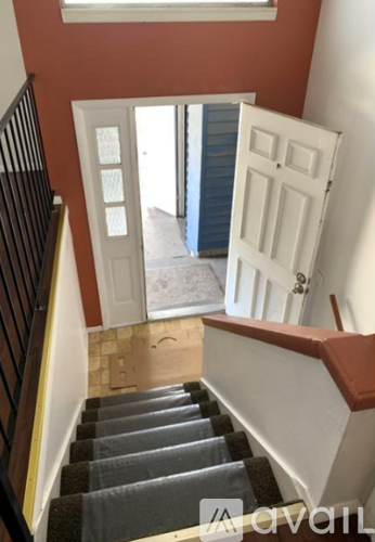 A staircase with a skylight above it.