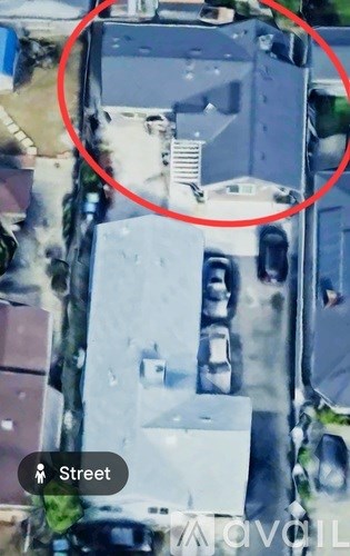 A car is parked in front of a house.