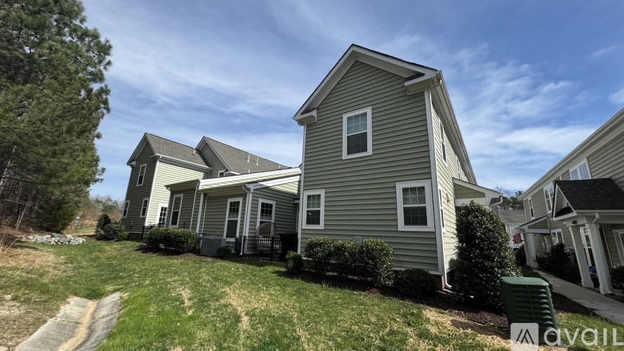 A row of houses with a sign that says "available" in front of the first one.