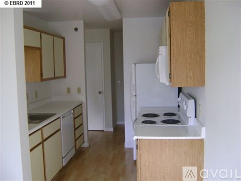 A kitchen with a stove and cabinets.