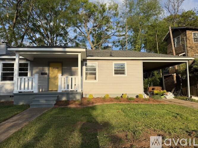A house with a garage is for sale.
