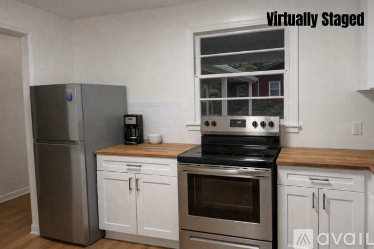 A kitchen with a stove, oven, and refrigerator.