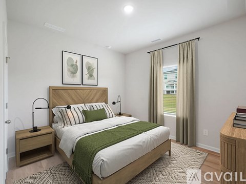 A bedroom with a large bed and two nightstands.