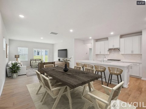 A modern dining room with a wooden table and chairs.