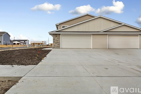 A house with a garage is available for sale.