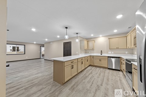 A kitchen with wooden cabinets and a white countertop.