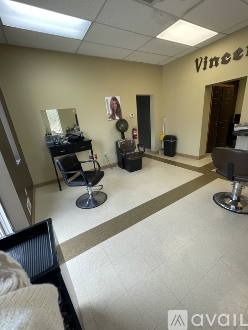 A hair salon with a sign that says Vince's.
