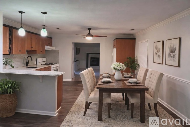 A dining room with a table set for six.