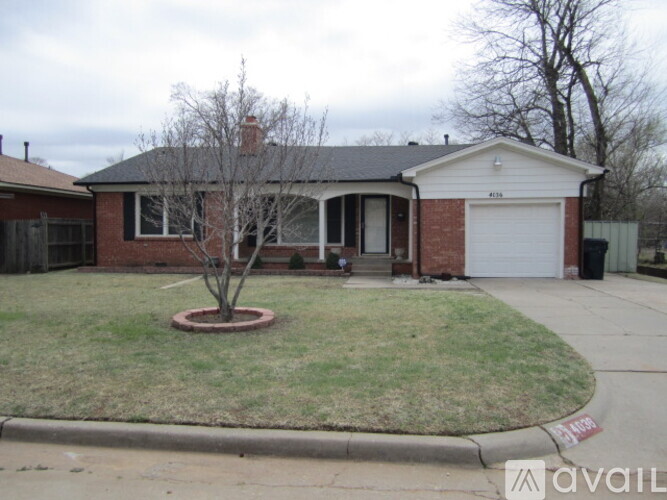 A house with a tree in a red circle in the front yard.