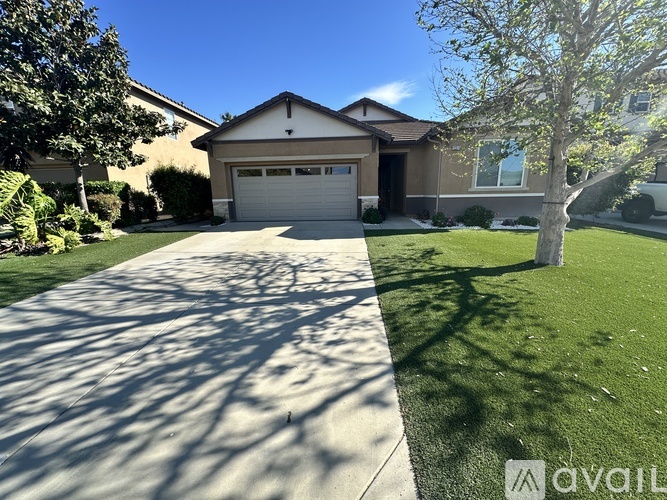 A house with a driveway in front of it.