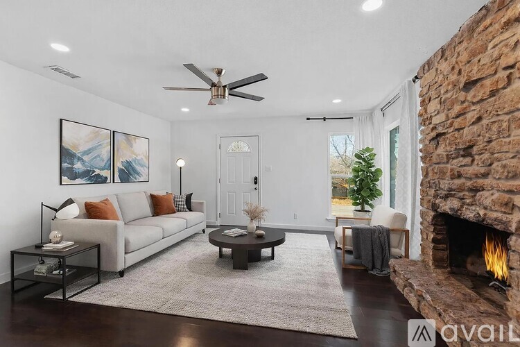 A living room with a fireplace and a couch.