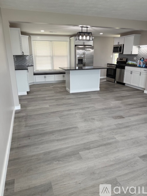 A modern kitchen with a large island in the middle.