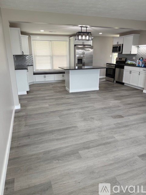A modern kitchen with a large island in the middle.