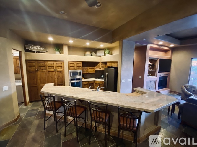 A kitchen with a bar area in the middle.