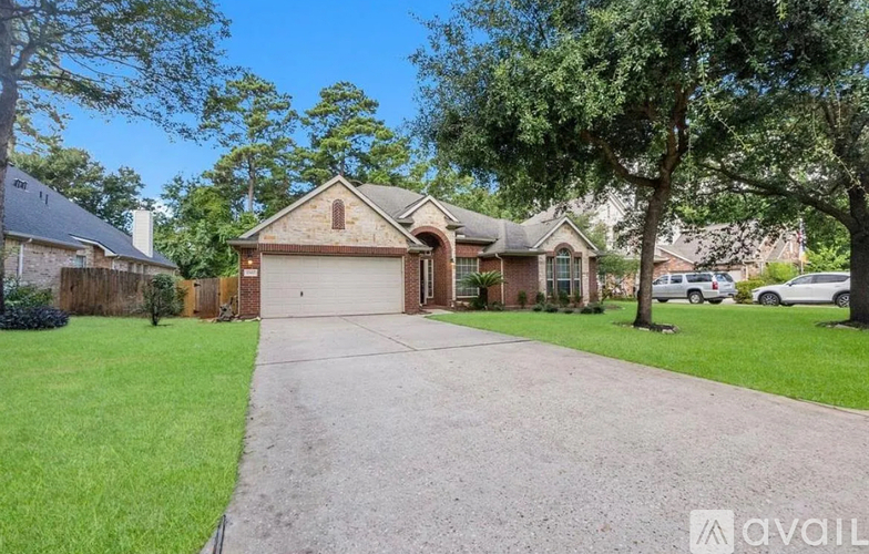 A house with a driveway and a garage is for sale.