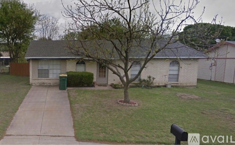 A house with a lawn in front of it.