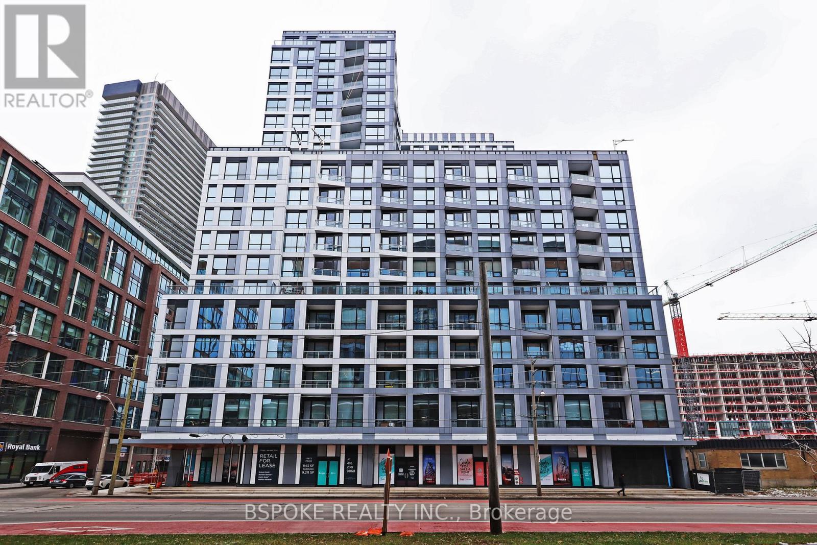 A large building with many windows is under construction.
