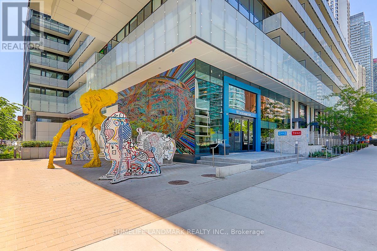 A large, colorful mural of a human figure is displayed in front of a modern building.