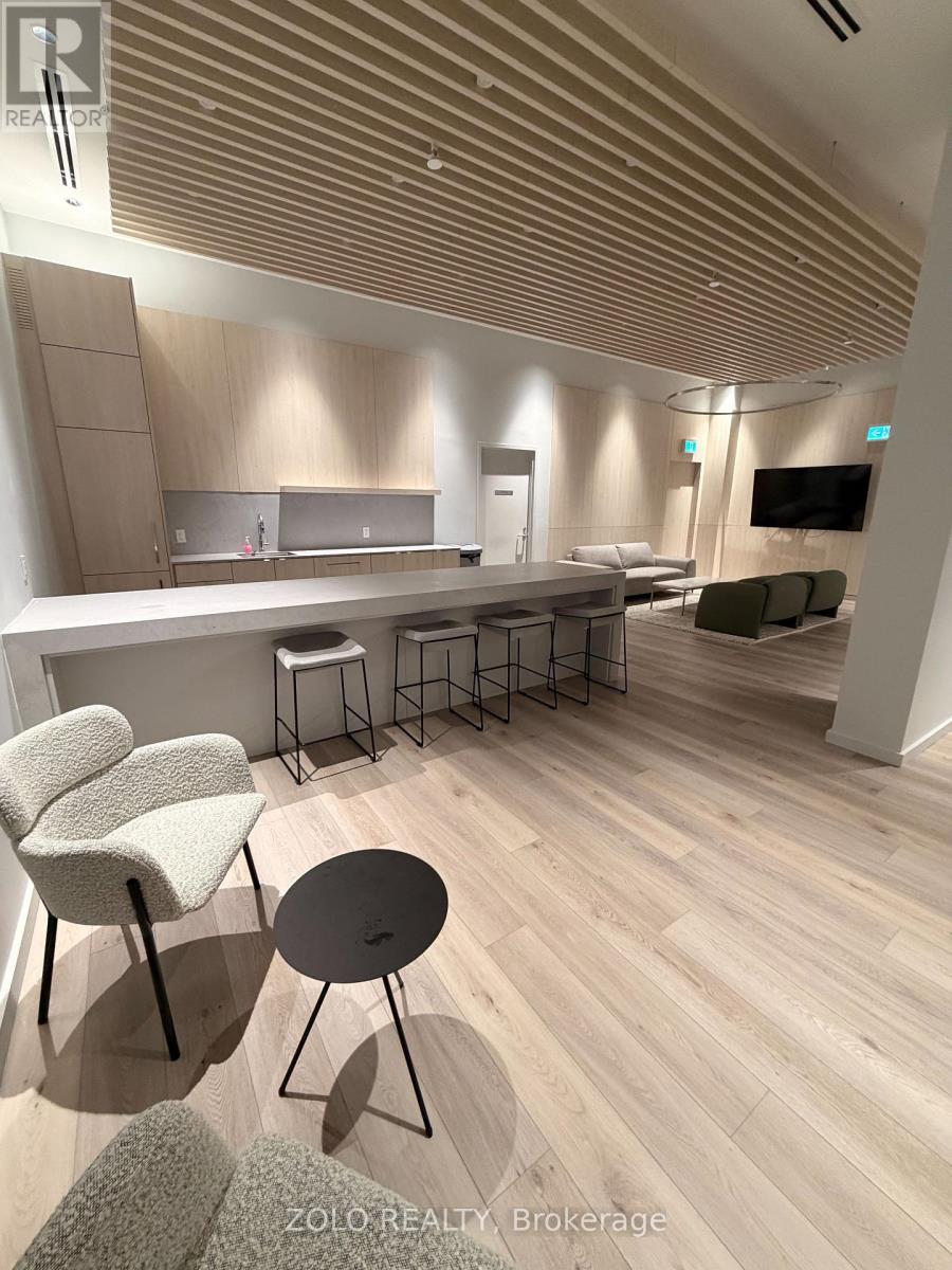 A modern living room with a bar area and a television.
