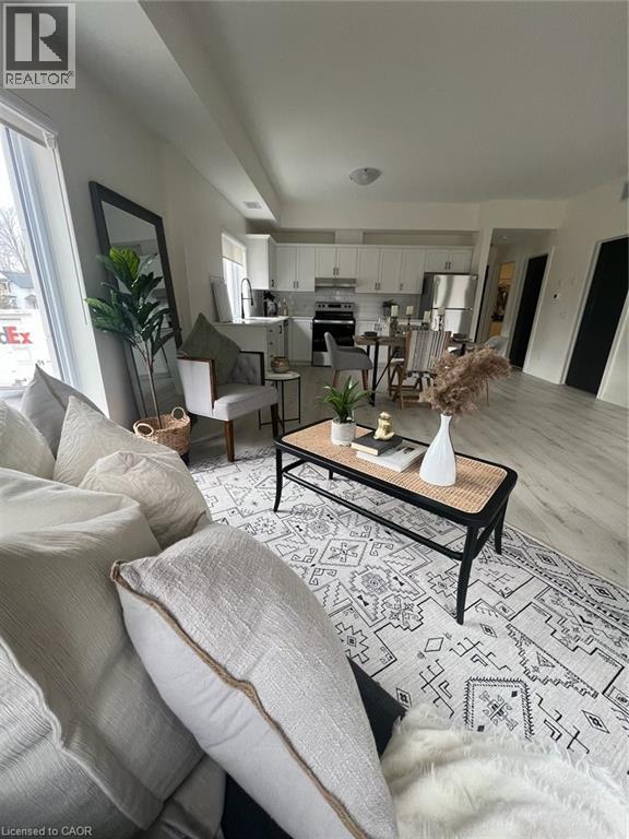 A living room with a grey couch and a coffee table.