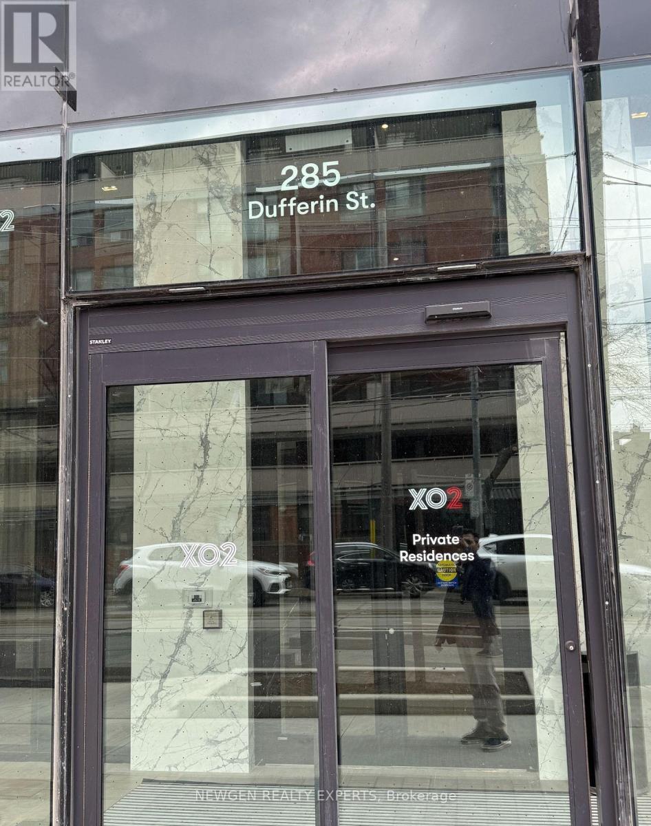 The front of a building with a glass door and a sign that says "285 Dufferin St."