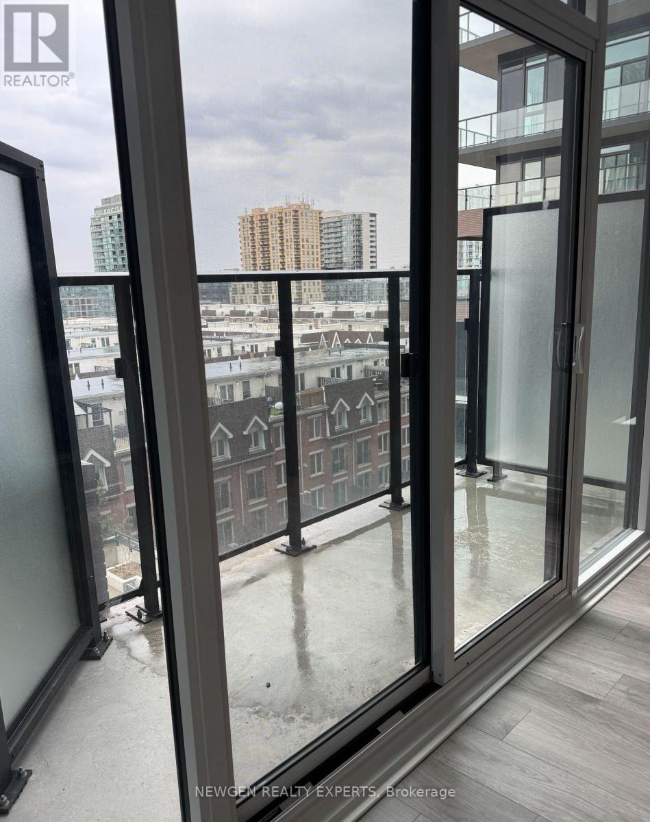 A view from a window looking out at a cityscape.