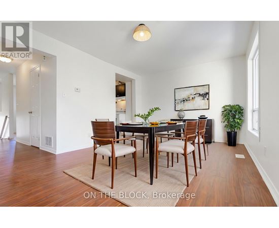 A dining room with a table set for six.