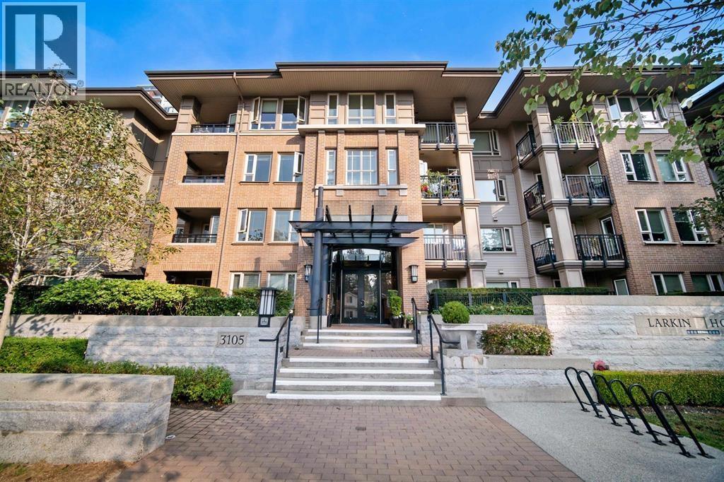 The entrance to a residential building with a sign that reads "Larkin House.".