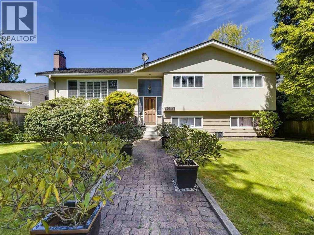 A house with a brick pathway leading to the front door.