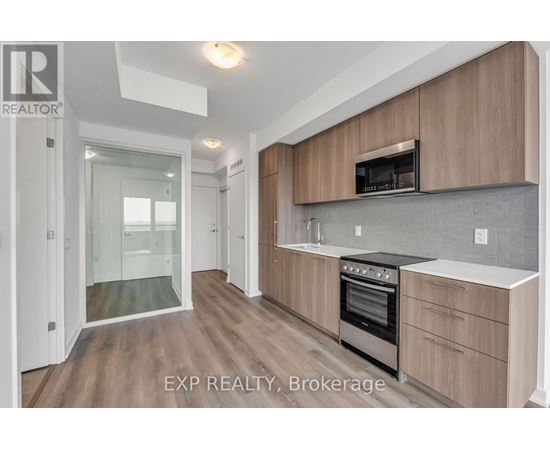 A kitchen with wooden cabinets and a stainless steel oven.